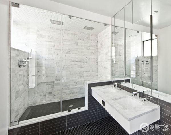 卫浴间通过玻璃门将干湿分区，并以灰白色和黑色塑造出一个凝练、利爽的空间；盥洗台方形悬挂柜难挡空间的现代范儿。