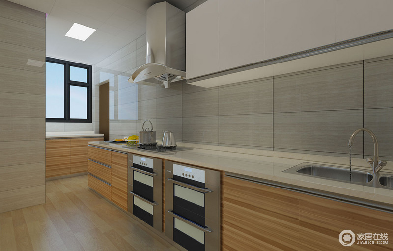 厨房主要以功能性为主，所以整体线条及橱柜的设计都十分简洁凝练；细纹的地砖与橱柜的木纹样式相似，以平缓塑造着空间的设计感。
