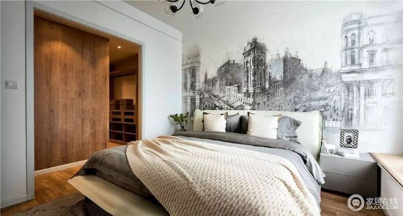 卧室并没有太多的造型设计和家具，单单以黑白背景墙画来演绎复古的艺术，灰色系床品看似高冷，却让人享受宁静。