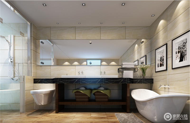 卫生间的布置成一字型的排列，打底的黄白理石墙砖凸显了空间的内容，盥洗台的炫黑与洁具的简白，与挂画色调灵动呼应。