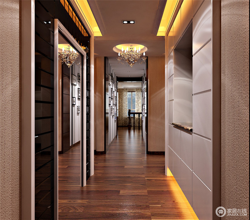 以黑色和灰白色为主的走廊偏冷色调感，无处不在的暖挚灯光则为型质空间增添一份暖意。一侧背景墙设置中空，适宜放置亮彩摆设，增添空间的暖色度。