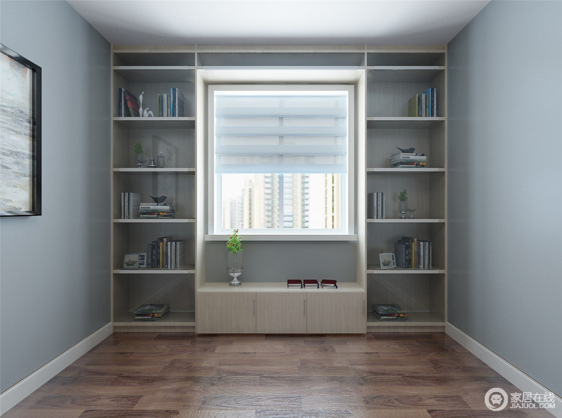 这是书房的一角，浅灰色漆粉刷的墙面显得素静而沉稳，实木书柜的设计与窗户连为一体，通过定制化设计将空间几何化，增加功能的同时，让空间多了份简单之美，让你好好再次放松。