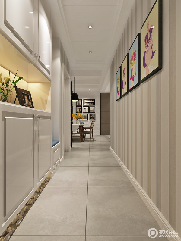 无论是客厅、餐厅还是走廊都体现了实用性的特点，利用定制边柜来体现其使用价值；条纹壁纸在彩色卡通画的点缀中，令空间明快而明媚，童趣而彩色感十足。