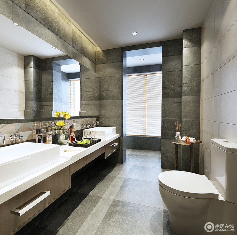 卫浴间以灰色砖石铺贴出自然朴质的效果，砖石的耐磨、抗水性是选材的关键，正是从实用性考量，才让材质的质感对空间的品质负责，悬挂式盥洗柜带来轻盈感，愈显舒适。