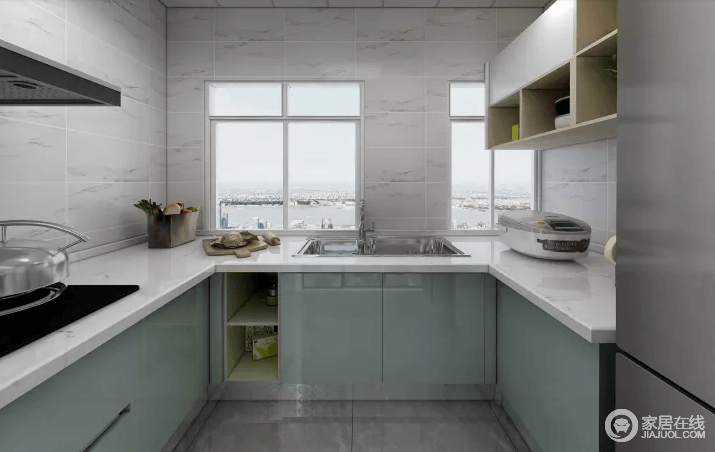 厨房的橱柜采用淡绿色，地面用灰色的砖，看起来比较简约一些，搭配白色台面，让整个空间格外清新。