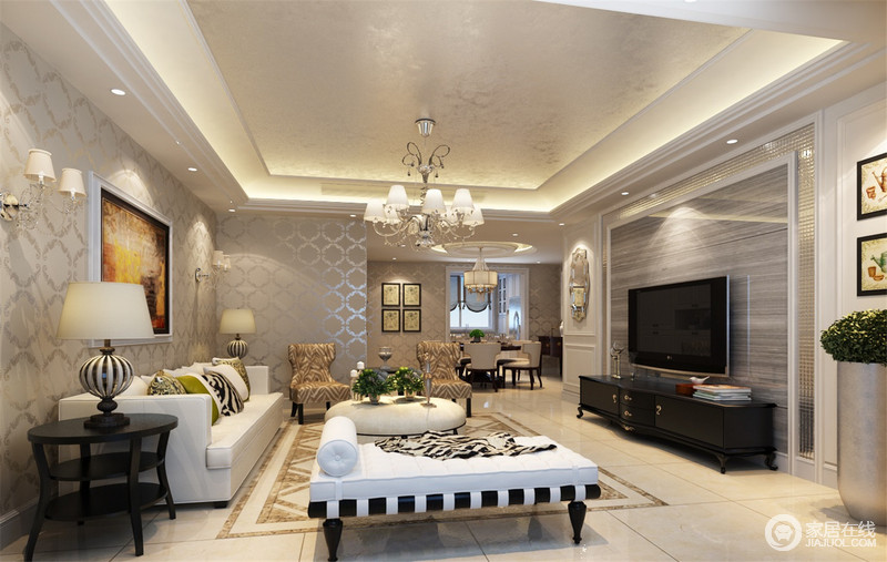 起居室以银灰色为底色，以细腻的理石纹路与波状形体图案铺陈出空间的沉静特质；米白、晶黑与条纹黄等家具色，使空间表现出更丰富的质感层次。