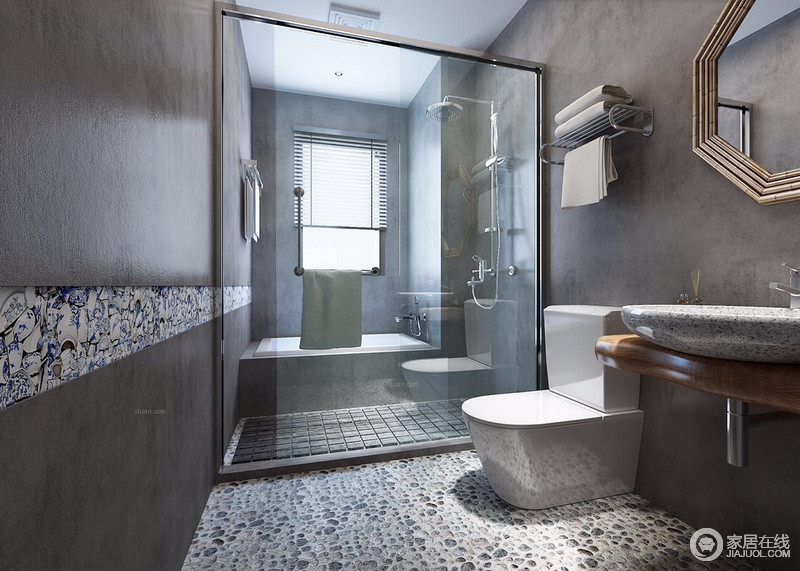 灰色的立面看似简单，却颇为个性，利用蓝白色彩砖进行装饰更显时髦；干湿分区带来劲爽的卫浴体验，斑驳有趣的地面打造出一个凝练、果敢的空间。