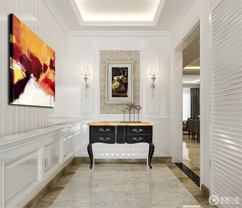 走廊散发着浓郁的新古典美韵，设计师利用曲线感的实木边柜和黄铜壁灯让几何线条和块面的墙面更显复古之意；抽象艺术画的色彩感让平淡的白色空间更显明艳，颇有古典艺术之风。