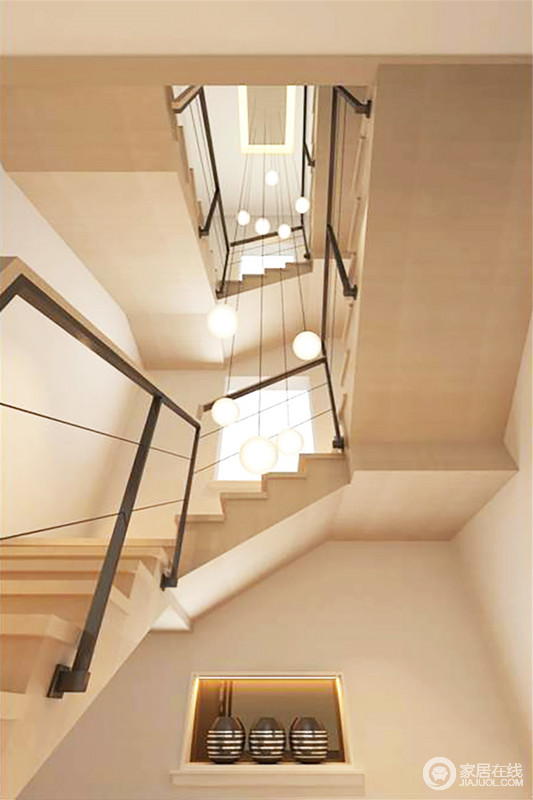 楼梯的设计以层叠的结构与稳重的建筑设计演绎现代设计的质感，简约的铁质楼梯没有掩盖空间感，反而对比出石材美学和质感；比例吊顶从上而下，一泻千里的感觉，更具动态。