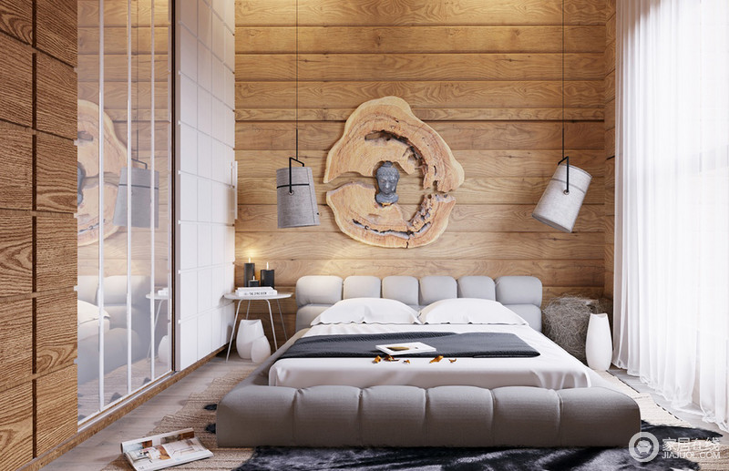 木制墙壁装饰,包括丰富的镶板和一块非常引人注目的床上,感觉很舒适和温暖。