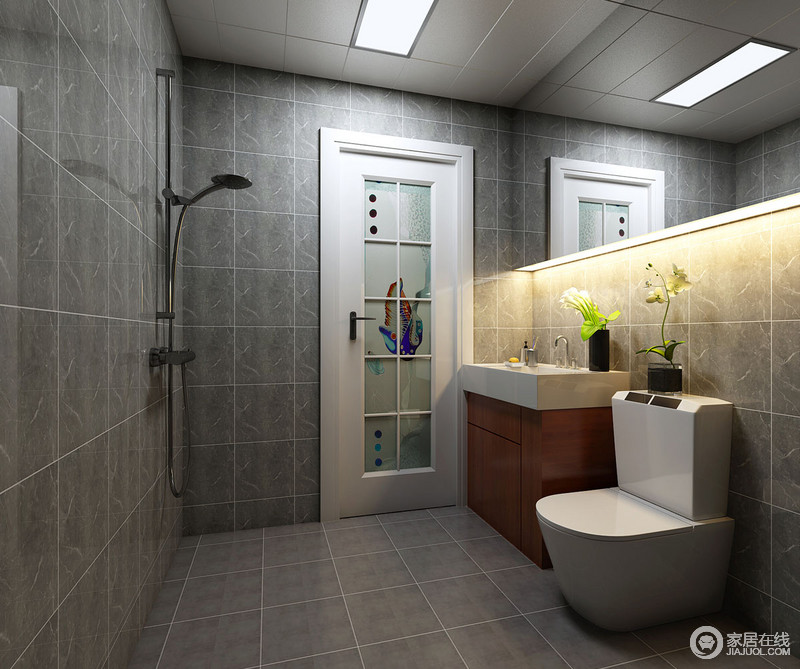 卫浴间统一选用深灰色砖营造视觉上的同一性，镜子下端通过灯带来增加光线的扩展性；实木盥洗柜与白色盥洗盆形成自然感的温润，显露着乡村的朴质。