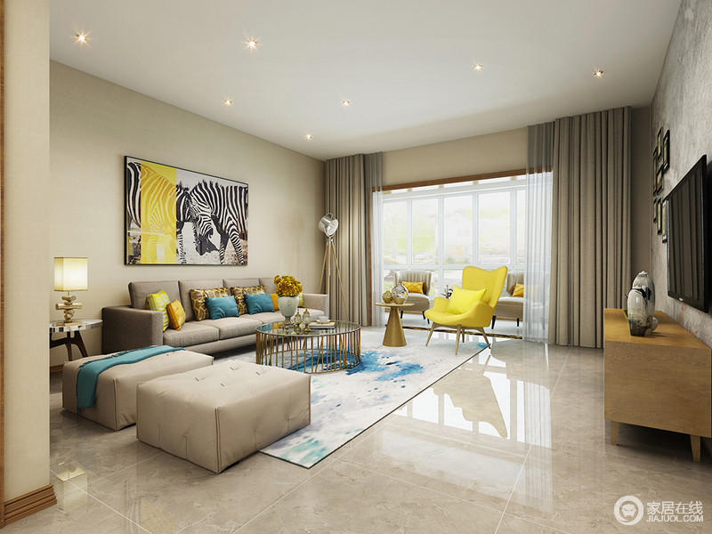 跳跃活泼的黄色与优雅蓝色活力揉进空间，将现代时尚明媚张扬的展现；不同饱和度的灰色运用在沙发和地面上，与米色墙面相近，形成空间温和理智的打底基调，令空间愈加凸显亮色彩的愉悦情致。