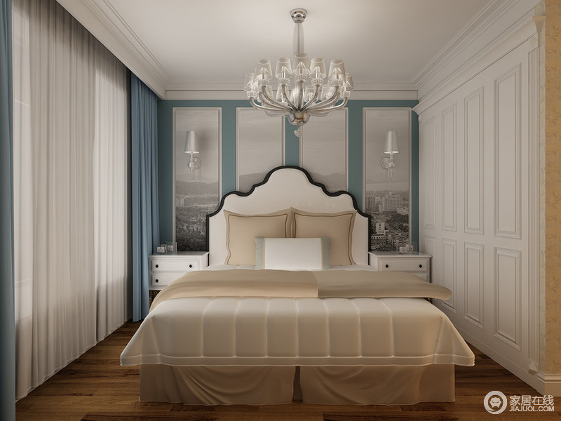 把具有人文气息的装饰画作为床头背景墙，营造出大都会的时尚气息。蓝色适时的点缀在白色其中，使平和与喧嚣结合，营造出动静相宜的优雅卧室空间。