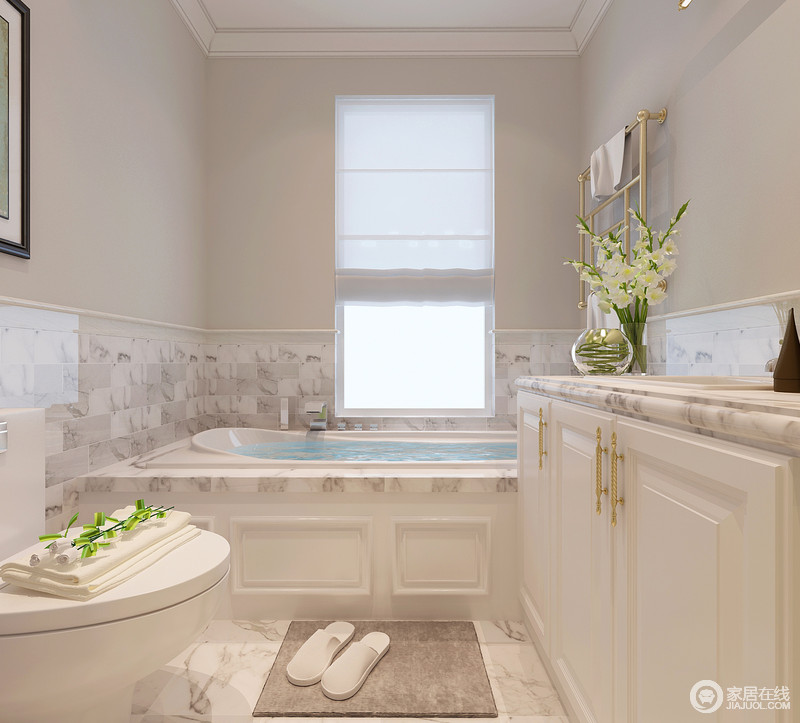 卫浴空间延续客厅的风格，使用拼接色墙面；大理石的花纹使素雅淡然的空间稍显活泼与层次性；由于空间的狭窄，再加上浴缸的安置，所以并不需要做干湿分离设计。