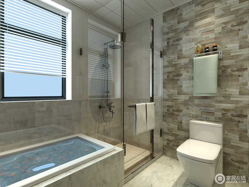 卫浴空间加入了马赛克砖墙，通过纹理强调局部背景空间。通透的玻璃隔离出淋浴间的区域，并贴心的放置了防滑木。浴缸的色调与整个背景空间相融，各个功能区域和谐平衡。