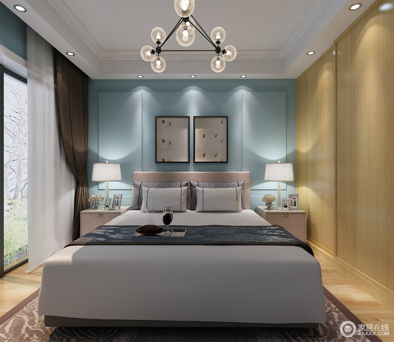 卧室以蓝色背景墙来缓和灰色床品的沉闷，并显得优雅而得体；实木衣柜并没有占据太大的空间，而是嵌入墙体与之形成统一化设计；简约而对称的设计中规中矩，将卧室的温馨缓缓散开，更富品味。