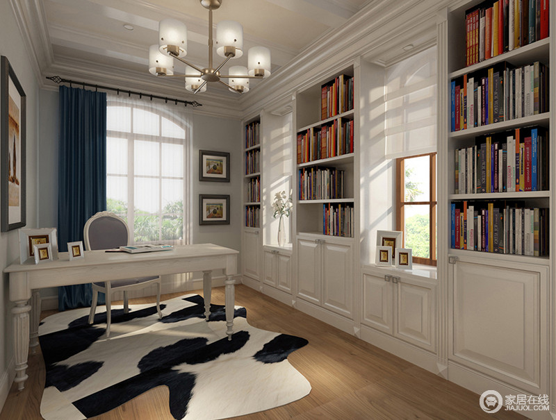 纯净的白色搭配温和的木色，光影透过窗户折射进来，彰显出悠闲小资的文化氛围。半开放式书柜依墙而设，书桌下方动物麂皮地毯则将空间与室外的自然，形成亲密的关联。