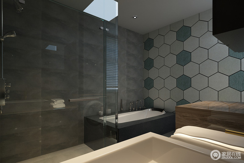六边形瓷砖铺贴在墙面形成一个立体的肌理，深灰色基调的卫浴间因为玻璃、陶瓷灯材质的组合而变得硬朗，也体现着现代大气。
