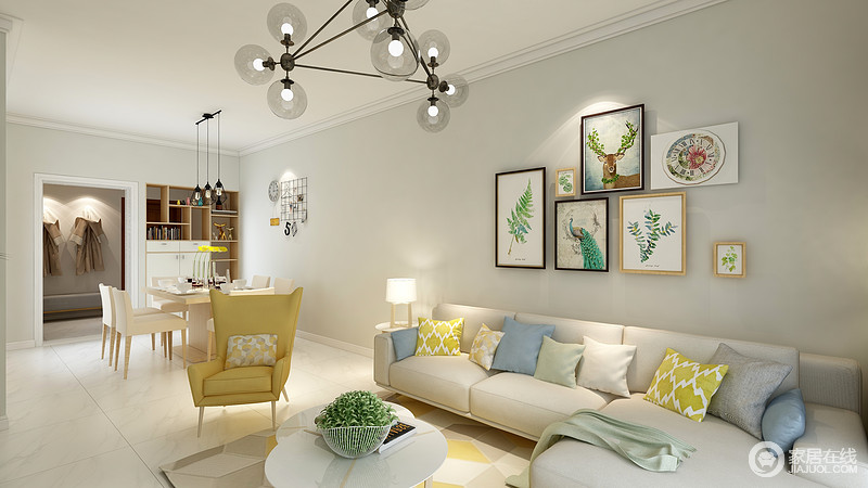 客厅因为铁艺球泡灯和台灯组合的照明设计变得温和，植物元素的照片组合给予空间自然清新；米色沙发因为多彩靠垫带来色彩上的张力，让生活足够温馨。