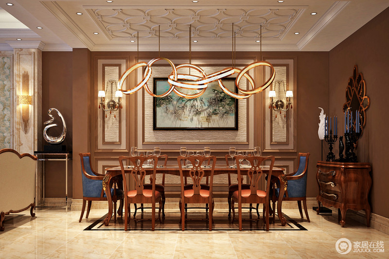 餐厅上的吊灯以现代的元素搭配着古典的木式餐椅，无论是家具还是配饰均以其优雅、唯美的姿态，平和而富有内涵的气韵，描绘出高雅、贵族；环状吊灯如同耀眼地火光将空间中的每件家具照得不一般。