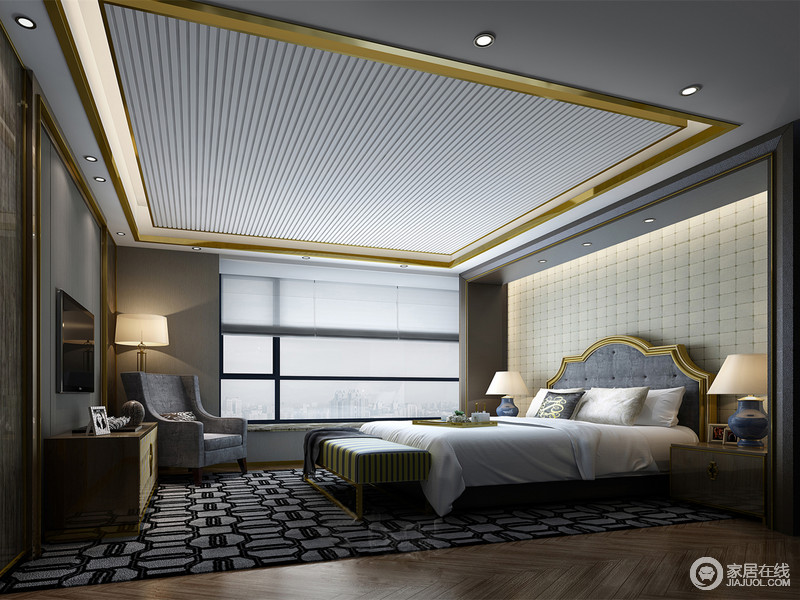 卧室布置的沉静简约，整体的灰色调间金铜线条轻奢营造，使内敛的空间多了时髦气质；床头背景墙、天花及地毯上大量的几何线条图形，为空间增添了丰富内容性；宽敞的玻璃窗带来了良好的采光，使从容雅逸的空间有着舒朗的通透感。