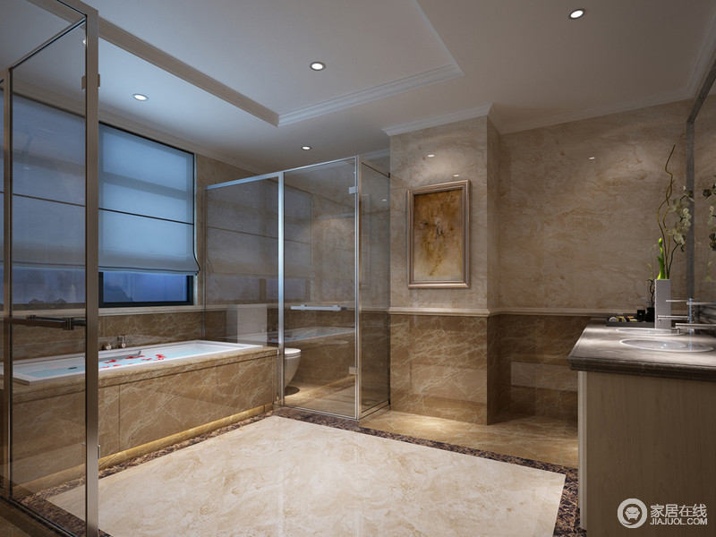 卫生间的设计比较简约，墙面进行了石材的拼接，丰富了视觉感官。淋浴与马桶区域分别做了玻璃材质上的隔离，形成干湿分区。中央区域开阔，便于活动。