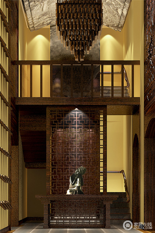 楼梯屏风前摆放佛饰品，天花为石头雕刻的佛文化图案，与定制的大吊灯搭配，整体有种寺院礼佛的禅意。