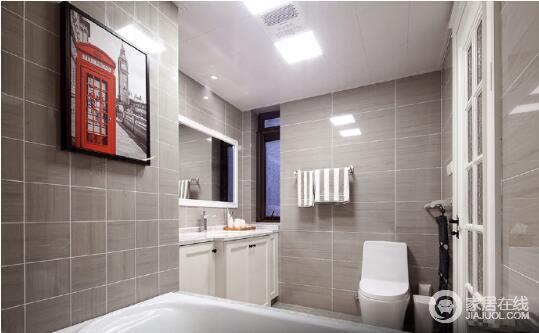 卫生间在色调上选用了浅灰墙砖来铺贴墙面，而白色盥洗柜、白色木框镜子和白色浴缸与之搭配出一种安静、素雅；毛巾架的实用，挂画的雅致，留动着简洁艺术，却实用有致。