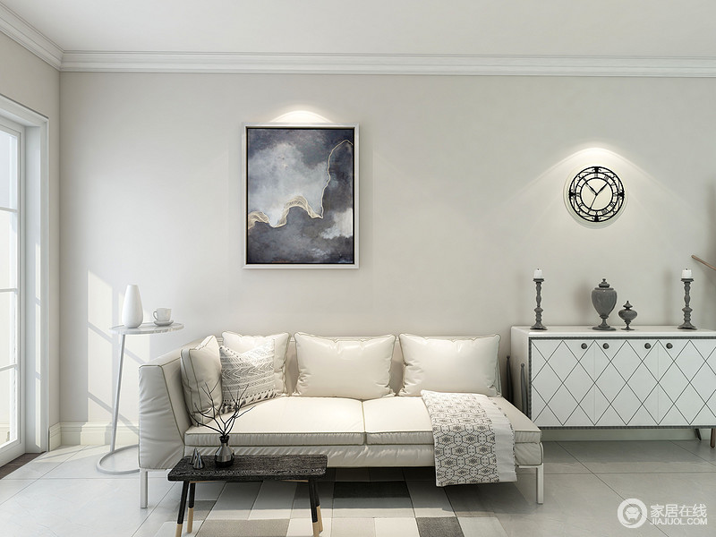 客厅米白色的漆搭配布艺沙发、白色边柜让空间格外安静，简约风的圆形边几和茶几裹挟着抽象风的挂画，让空间具有艺术气息。
