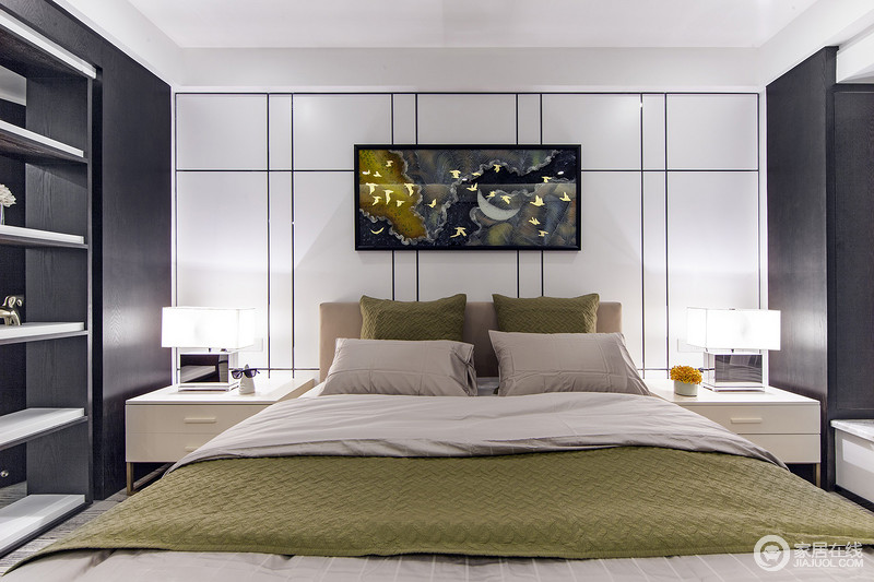 卧室床头墙面上，设计师用规整的黑色线条描绘，几何的质感带来富有节奏的韵味，与抽象画作展现出艺术腔调；床品在粉绿交织中，与背景的白色形成层次，空间在独特的碰撞中，平衡材质与形态，演绎冷艳高雅风尚。
