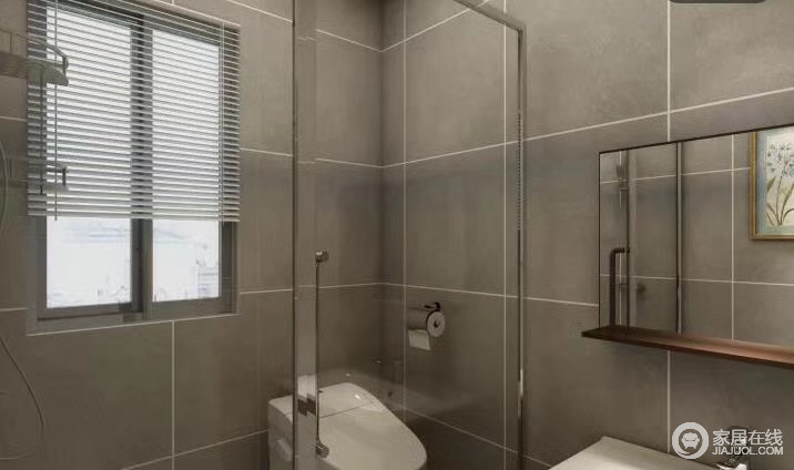 卫浴间以灰色砖石铺贴，墙缝勾勒出几何感，素静而利落；玻璃淋浴房干湿分区，更易打理。