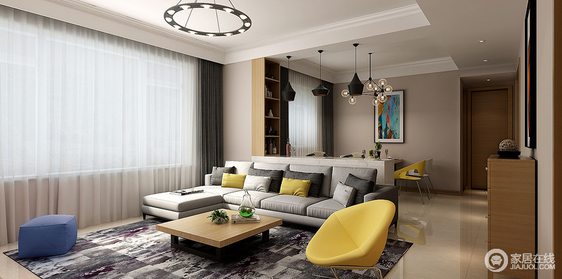 客厅开放式的设计让空间的功能性愈加强大，设计师通过白色置物台将其一分为二；灰色布艺沙发被黄色靠垫点缀，与明黄色椅子形成应和，并与蓝色坐墩让灰白紫拼色地毯更显优雅。