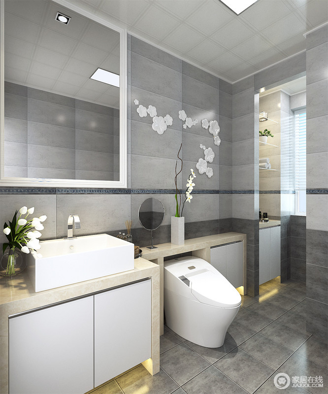 灰色仿古砖打造的卫浴间多了份传统的朴实，与精简的线条让空间多了份简单之美；实用的盥洗柜因为方体的造型，颇为引人注目，在花器的装点中，更显雅致。