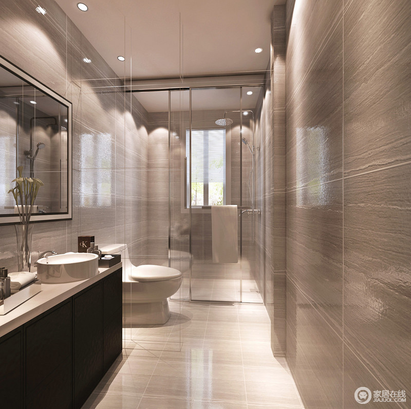 卫浴间以玻璃与石材的硬朗感碰撞出不同材质混合的魅力，看似沉闷的色彩却呈现着大地般的包容力，更加耐磨耐脏；简洁的设计十分利落，与整体现代化的设计打造着洁净而质感的卫浴生活。