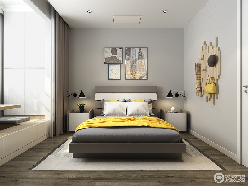卧室以灰色漆粉刷墙面，与黑咖色床品、深灰木色木地板形成色彩反差，构成空间的层次；挂画或者墙饰的点缀，让家多了艺术感。