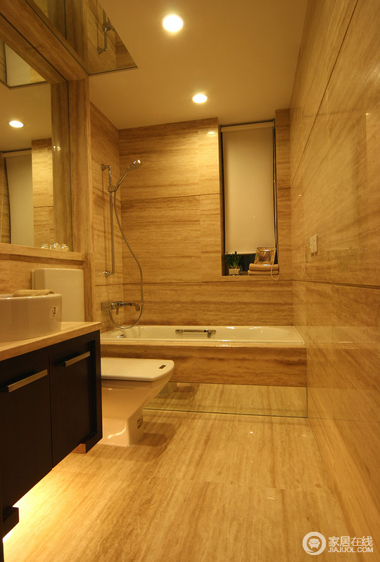 卫浴空间中整体选用石材墙体打通整体，简洁大气的同时整齐划一。