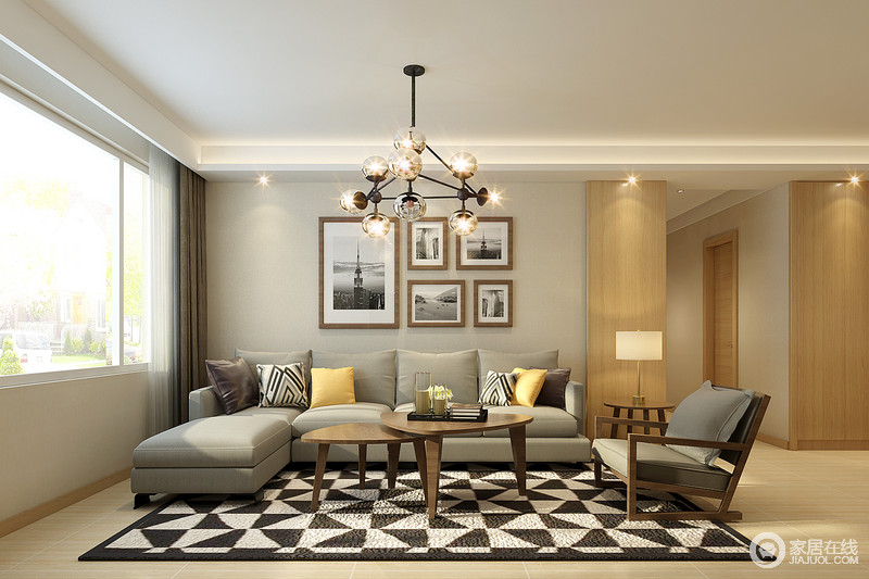 几何地毯、装饰画、靠包与魔豆灯，使烟灰色的空间充满了视觉感；设计简约的同色系沙发和座椅，搭配折叠式实木三角茶几，构成一个舒适简单的客厅空间。