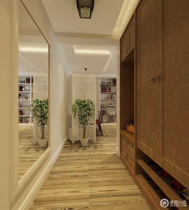 设计师巧妙地利用收纳实木柜将走廊区的实用感表现出来，合理地设计显现出设计哲学；白色折叠式屏风将餐厅与其之区分，以空虚结合的形式，让空间更具呼吸感，一盆绿植和一面镜子装饰出静动之美。