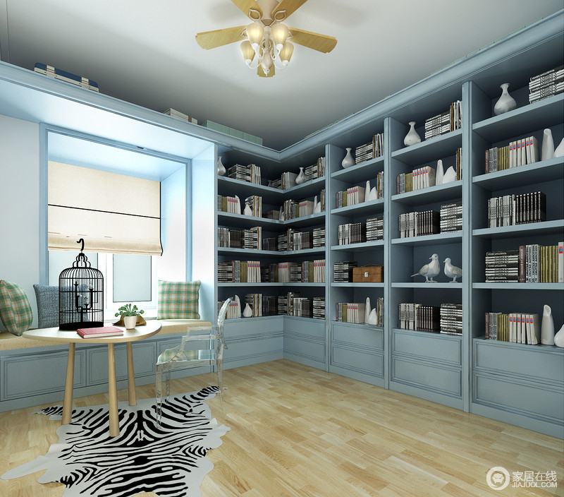 书房内原木地板铺贴出了自然朴实，让人更能沉下心来阅读；而蓝色书柜靠墙设计极具文艺气息，让生活多了书香和悦。