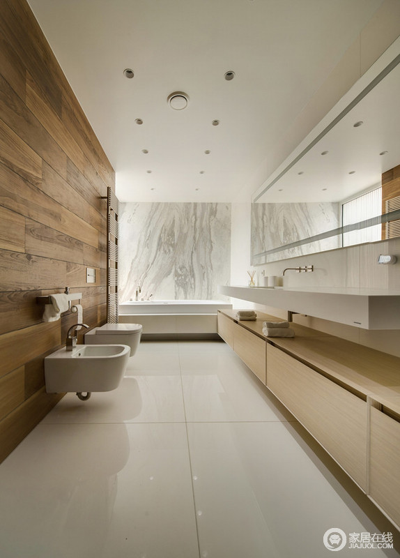 简洁、温实的卫浴间尽显现代设计的清雅，地板上墙的方式演绎了木材的另一种魅力；实木盥洗柜简约而中规中矩，与方形盥洗盆以几何之美，生动地讲诉了当代设计的宁雅。