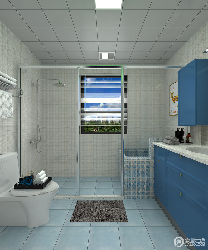 卫生间设计的功能十分分明，浅蓝色地砖搭配靛蓝色橱柜，让空间更为轻快，再加上干湿处理，让生活简单了不少。