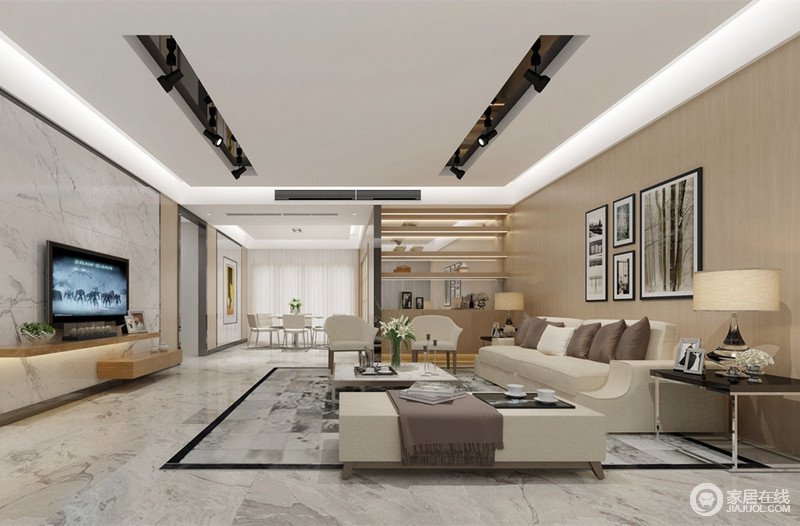 灰白的理石从电视墙到地板，延伸了视觉整体感。暖色系的沙发背景前米白沙发上点缀了灰褐色布艺，茶几、边几的拼接金属，使现代空间更具低奢设计感。