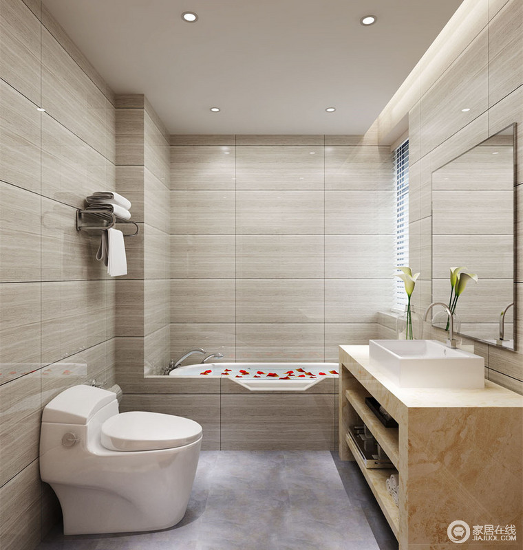 大块砖石的缝隙充满了线条的丰富性，使毫无装饰的卫浴空间并不显单调。浴缸与墙面结合，形成整体，盥洗台则采用米黄色大理石，与灰色地板平衡了空间视觉的单一性。