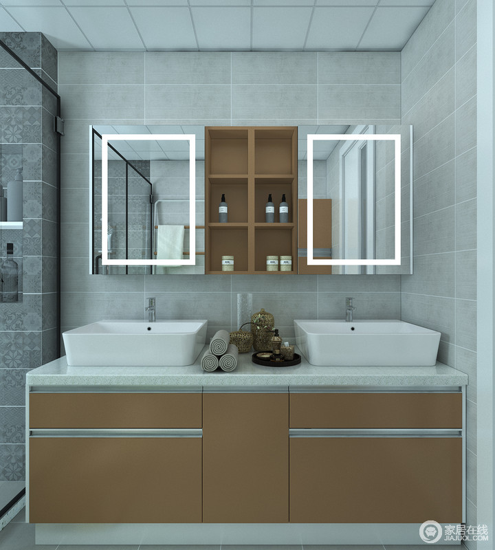 卫生间内的盥洗区以浅灰色砖石铺贴墙面，突出了简素的设计理念，同时更耐脏，镜面悬挂柜和盥洗柜解决了收纳的难题，更为实用。
