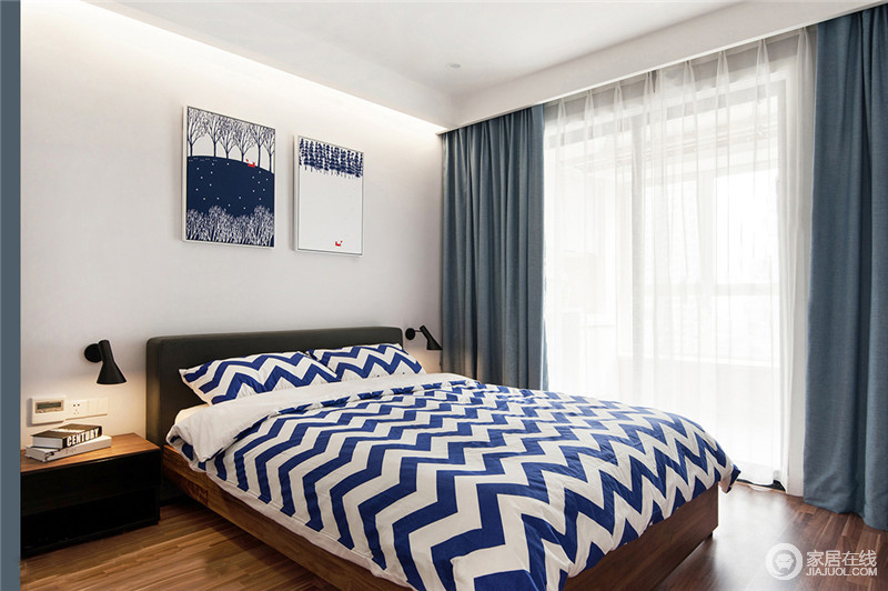 卧室中设计师在软装布艺上选了灰蓝色，还原本质的风格，背景画个性有趣味