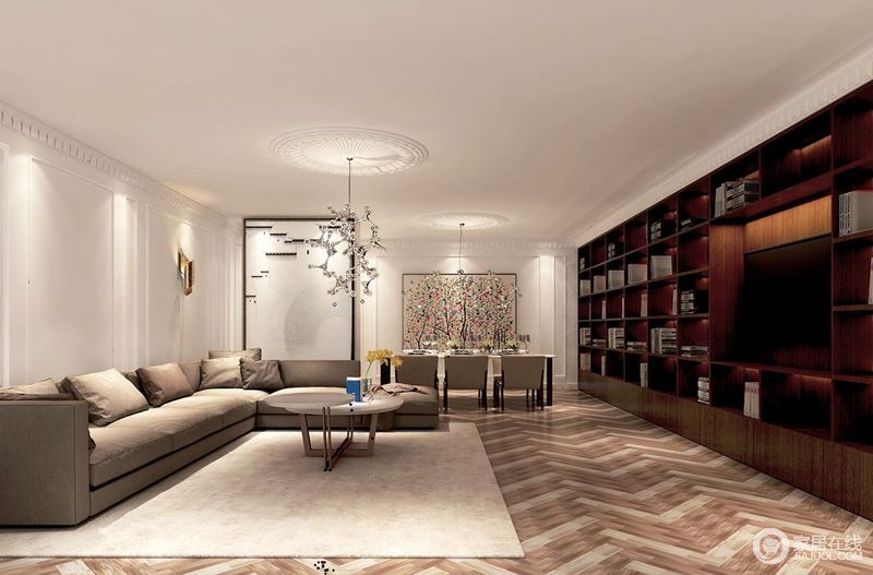 整个空间色调鲜明，素雅的白、灰与原木色形成强烈对比。一面护墙板和沙发以极简的姿势呈现，一面环绕式书架气势的占据了一整面墙，混搭成刚柔并济的空间形态。