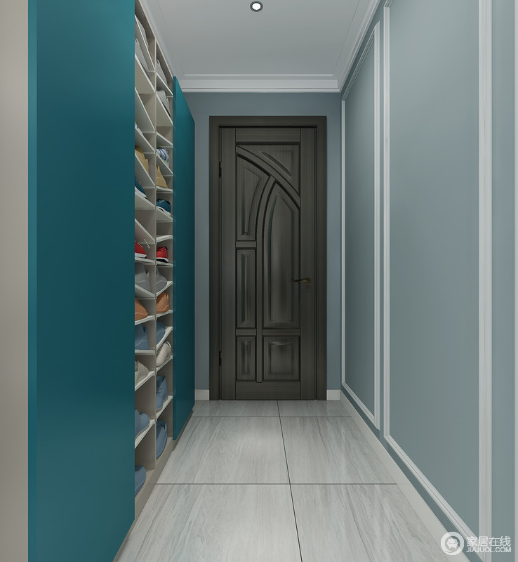 门厅看似线条简单，却功能性十足，浅蓝色的墙面因为白色石膏线而凸显着几何简美；另一面墙将其设计为鞋物收纳区，利落而实用，并以深海蓝与之构成色彩的变化，让空间简单之中，多了色彩的能量。