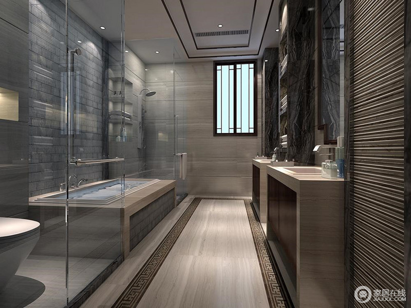 卫浴空间也选择灰色系为主，大理石和粗犷的文化砖，在条纹和纹理营造下，浓厚深沉。清透的玻璃材质，则中和了空间的厚重，并分隔出了空间的干湿区域。