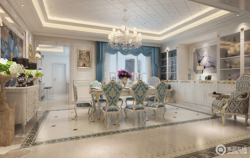 餐厅除了延续客厅的浅白搭配天蓝的基调外，增加了精美繁复的印花和细腻贵气的金色雕花，空间展现出洛可可式的绚丽优雅，营造浓郁浪漫气质的就餐环境。