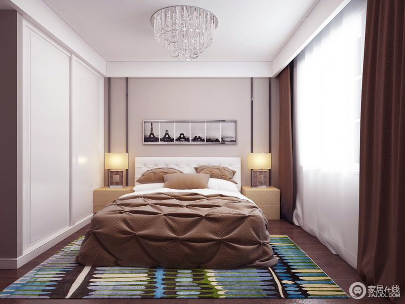 卧室以白、咖为主色调，以利落简洁的手法陈设家具，意在营造出温馨静谧的休憩空间。而一方拼色地毯，则瞬间提亮空间色调，在安静中制造出跳跃的缤纷感，打造充满变化的美感。